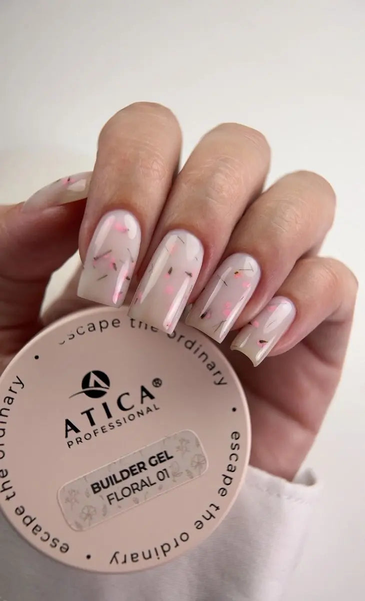 Hand with painted nails holding a container of Atica Professional Builder Gel.