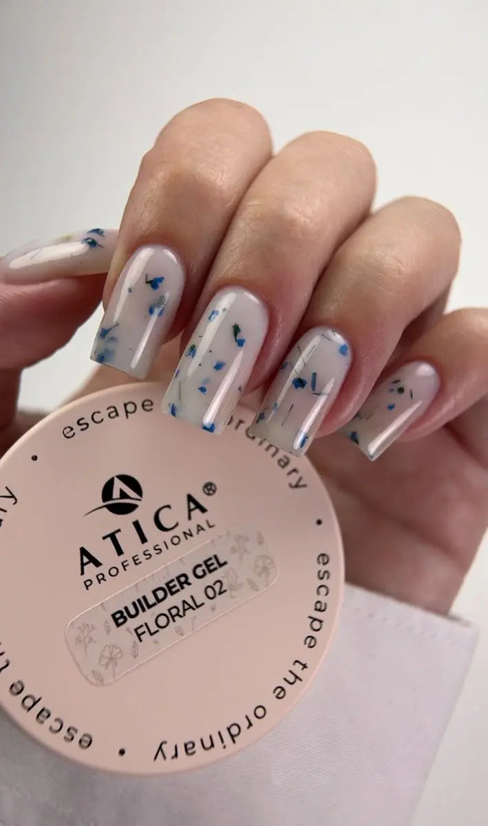 Hand with painted nails holding a container of Atica Professional Builder Gel.