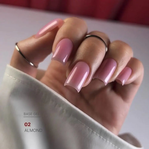 Warm almond nude nail base texture swatch, natural camouflage effect