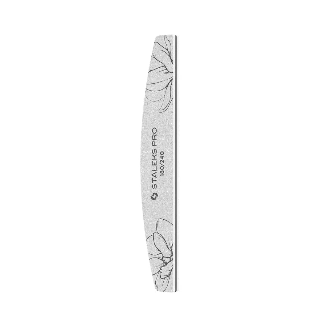 Closeup of Staleks PRO expert 40 crescent nail file showing white abrasive and wooden core with foam