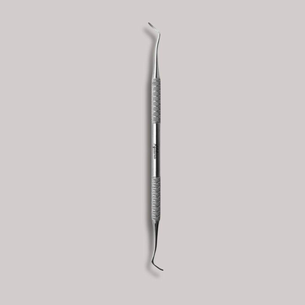 Afilara Professional Double-Sided Pedicure Curette made of stainless steel for callus removal and foot care, designed for precise and comfortable use during at-home pedicures.

