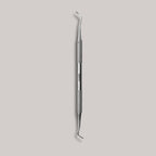 Afilara Professional Double-Sided Pedicure Curette made of stainless steel for callus removal and foot care, designed for precise and comfortable use during at-home pedicures.

