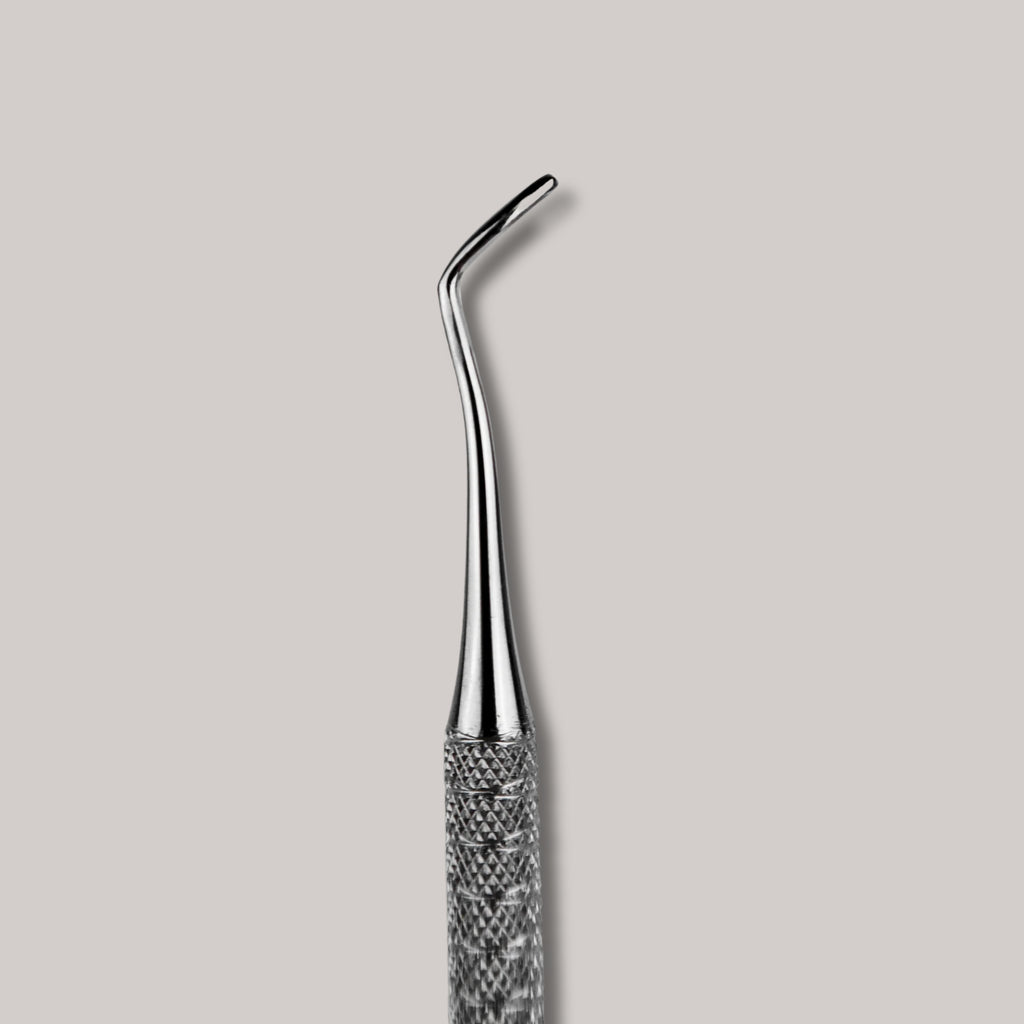 Afilara Professional Double-Sided Pedicure Curette made of stainless steel for callus removal and foot care, designed for precise and comfortable use during at-home pedicures.

