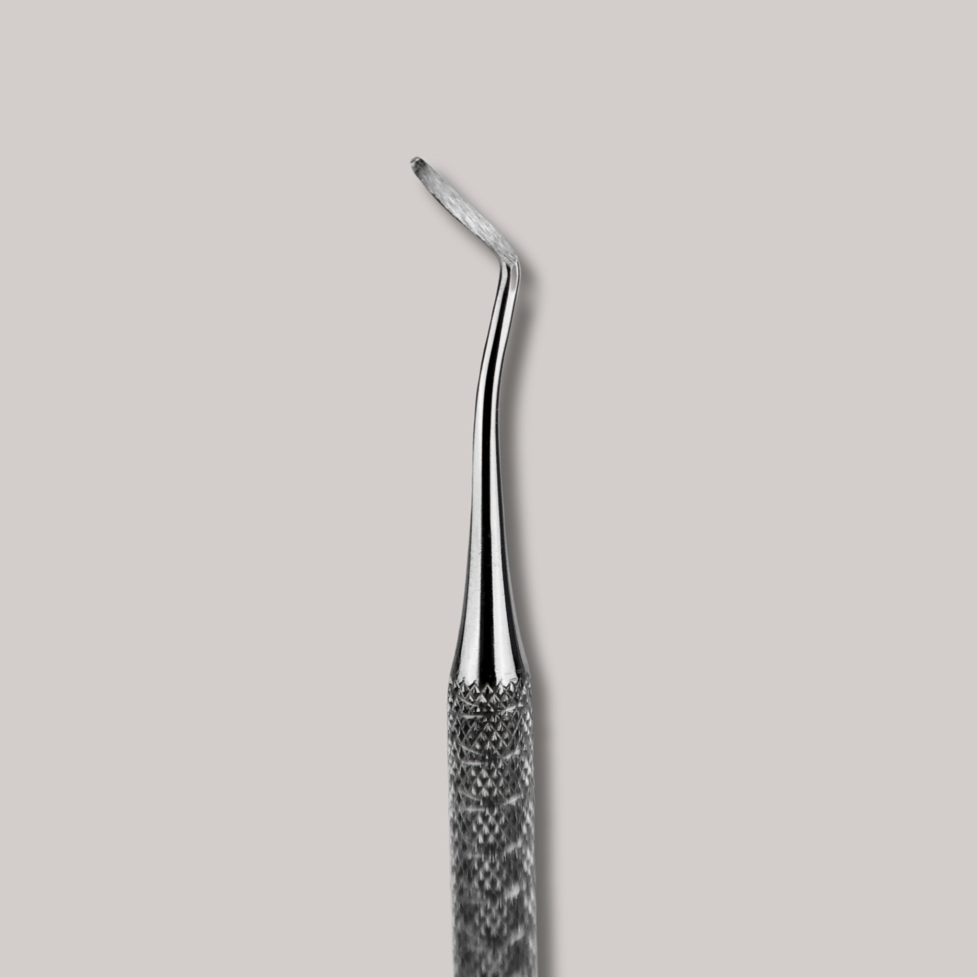Afilara Professional Double-Sided Pedicure Curette made of stainless steel for callus removal and foot care, designed for precise and comfortable use during at-home pedicures.

