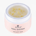 Pink jar of Atica Professional Nail System on a white background