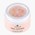 Pink jar of Atica Professional Nail System on a white background