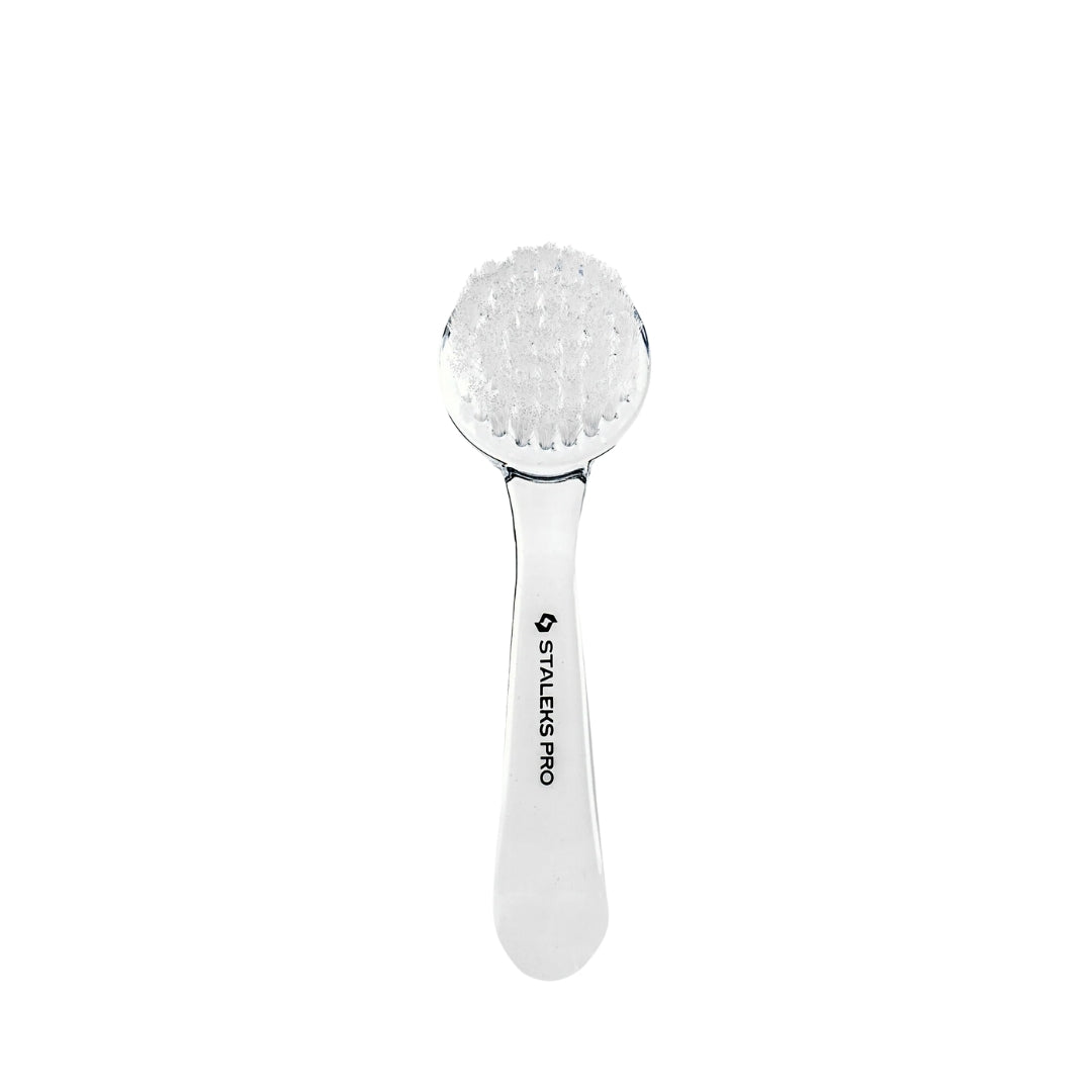 Durable nail cleaning brush with synthetic bristles, curved handle, protective cap, and compact design for easy use and transport.