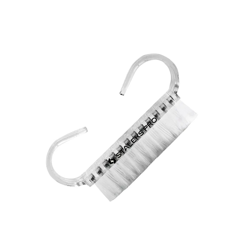 Closeup of Staleks PRO manicure dust brush showing transparent handle and synthetic bristles
