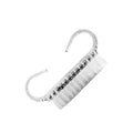 Closeup of Staleks PRO manicure dust brush showing transparent handle and synthetic bristles