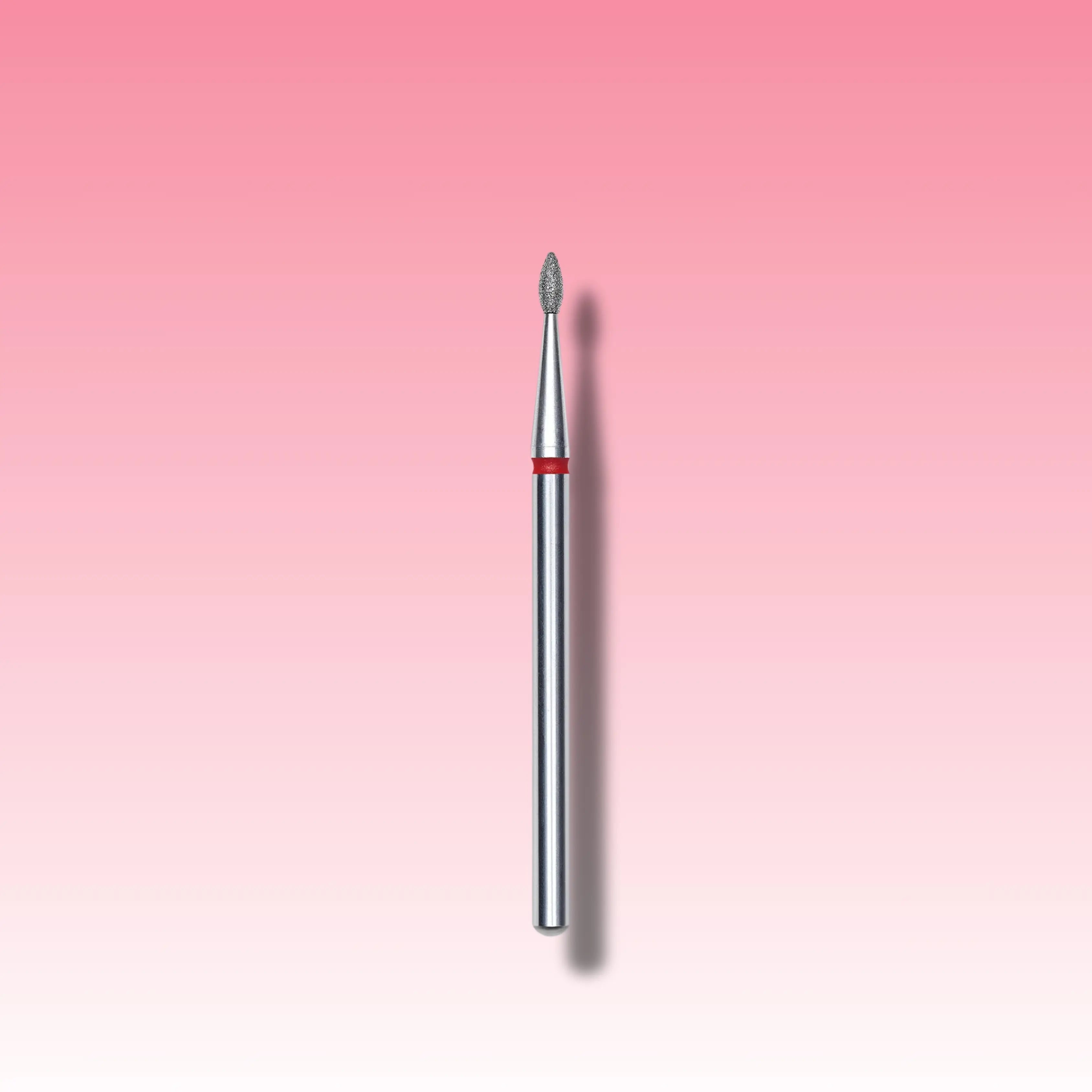 Soft abrasive red nail drill bit for safe and precise manicures and pedicures.