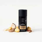 Clay face mask container with natural ingredients on a white background
