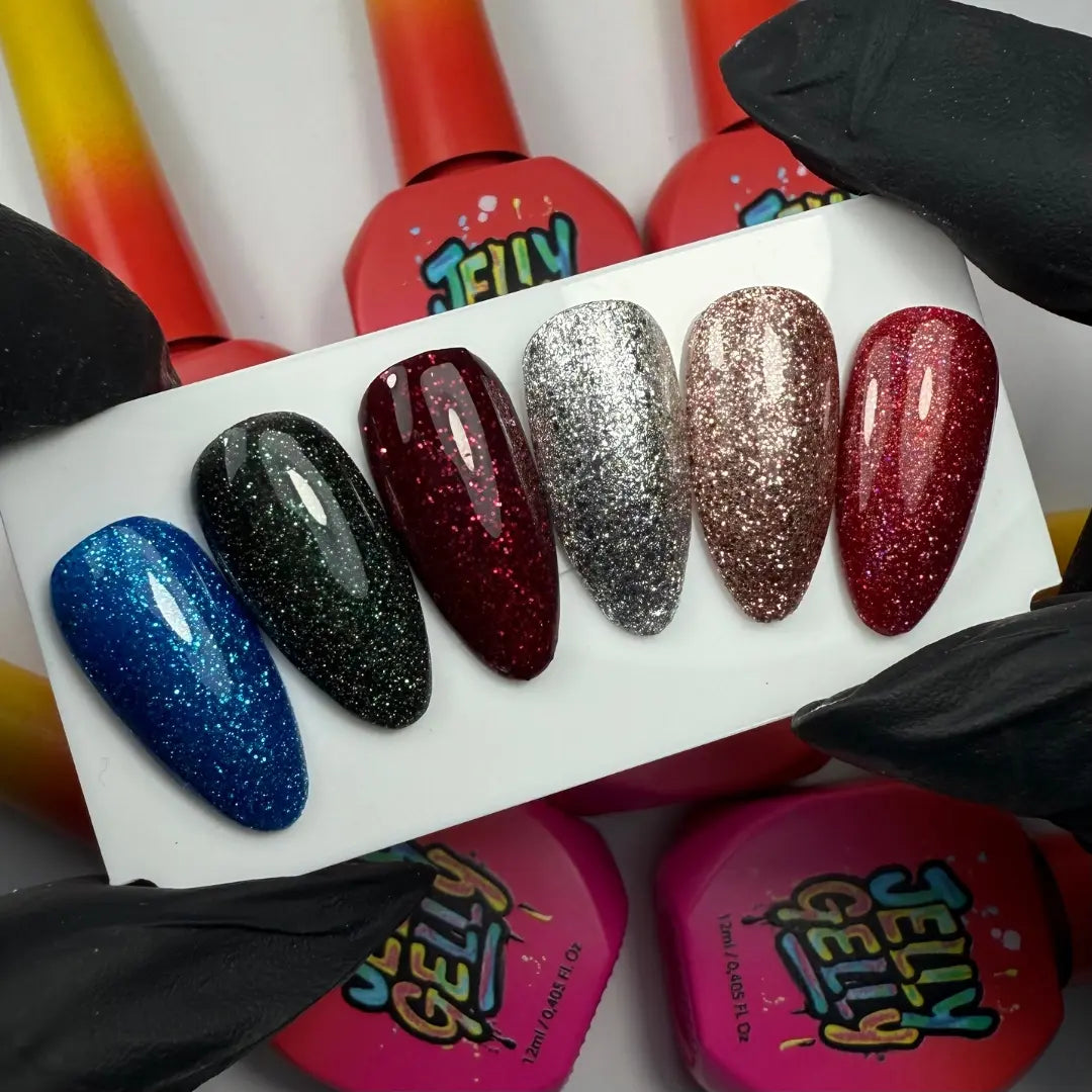 Set of colorful glittery nail polish samples on a white card with 'Jelly' brand visible.