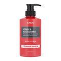 A 500 ml bottle of KUNDAL Honey & Macadamia Body Lotion in Amber Vanilla scent, featuring a vibrant red bottle with a black pump dispenser and a black and white label.