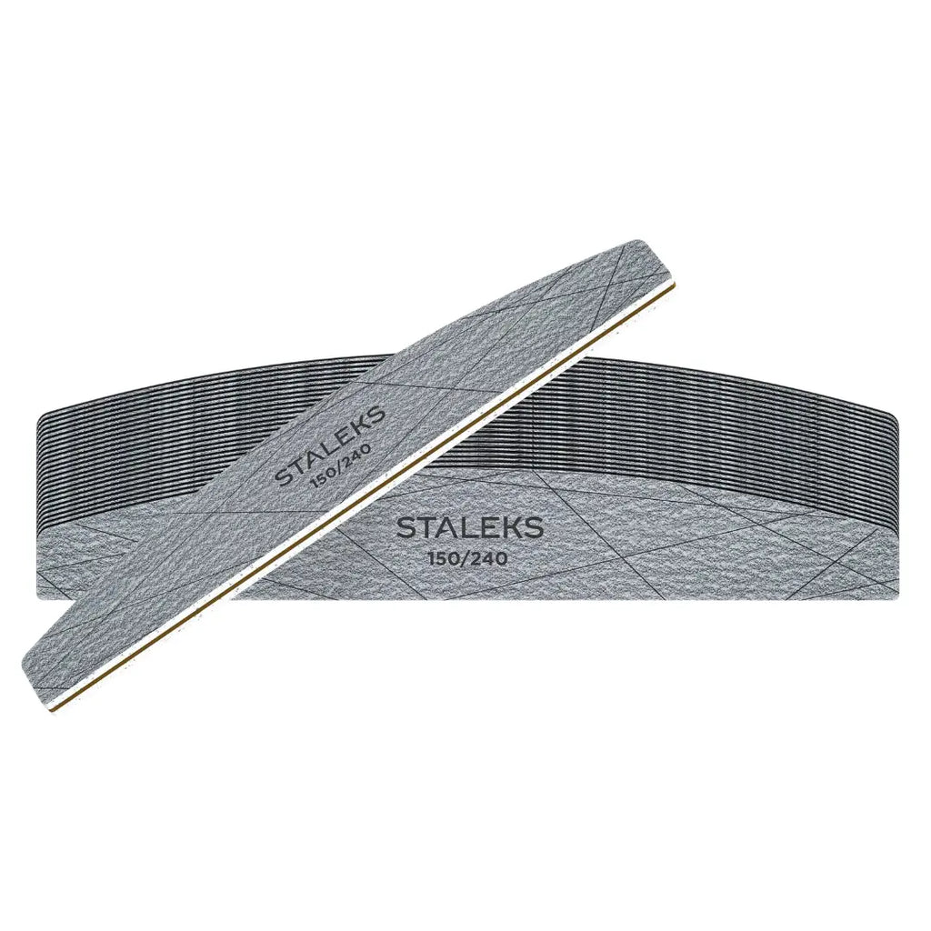 Two gray STALEKS 150/180 grit nail files crossed over each other on a plain white background.