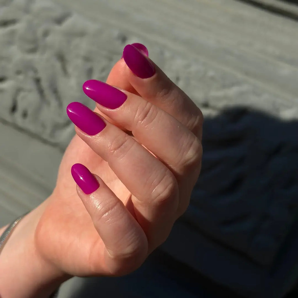 Agent Girl vibrant magenta gel nail polish on almond-shaped nails in sunlight – Jelly Gelly Gel Polish 8ml