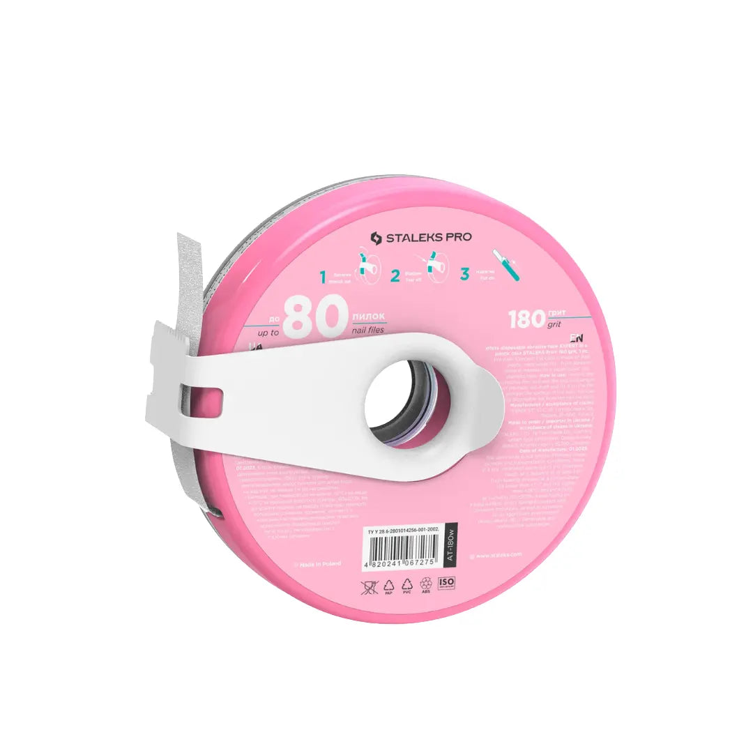 Closeup of Staleks PRO donut 180 grit adhesive tape backing and cutting clip