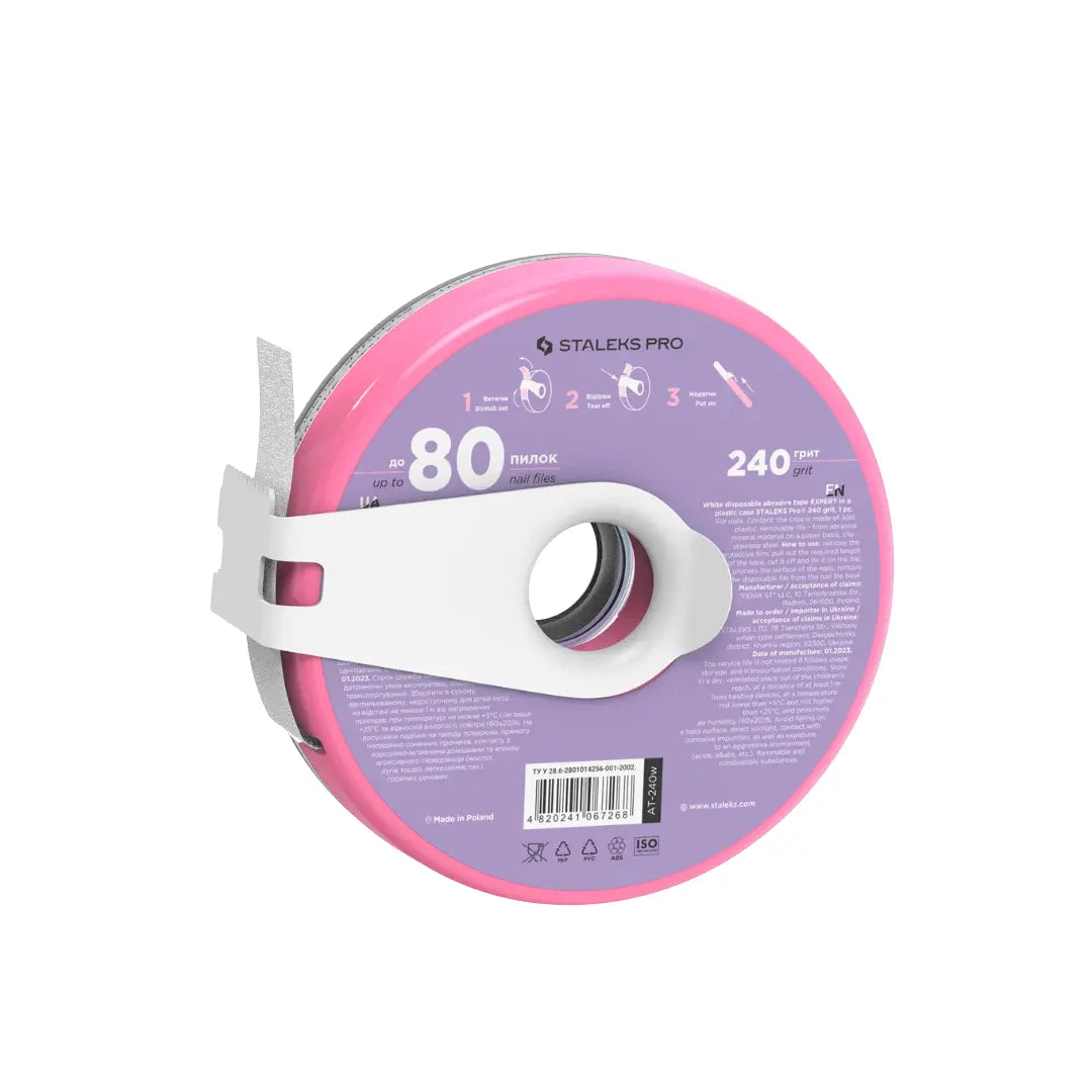 Closeup of Staleks PRO donut 240 grit fine adhesive tape backing and cutting clip