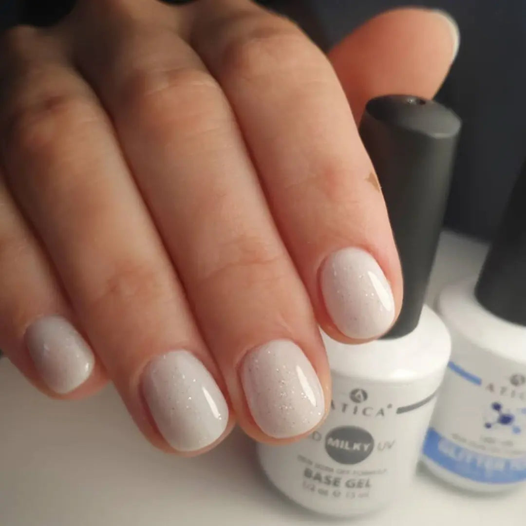 Milky white nude nail base swatch, semi-sheer soft white camouflage effect