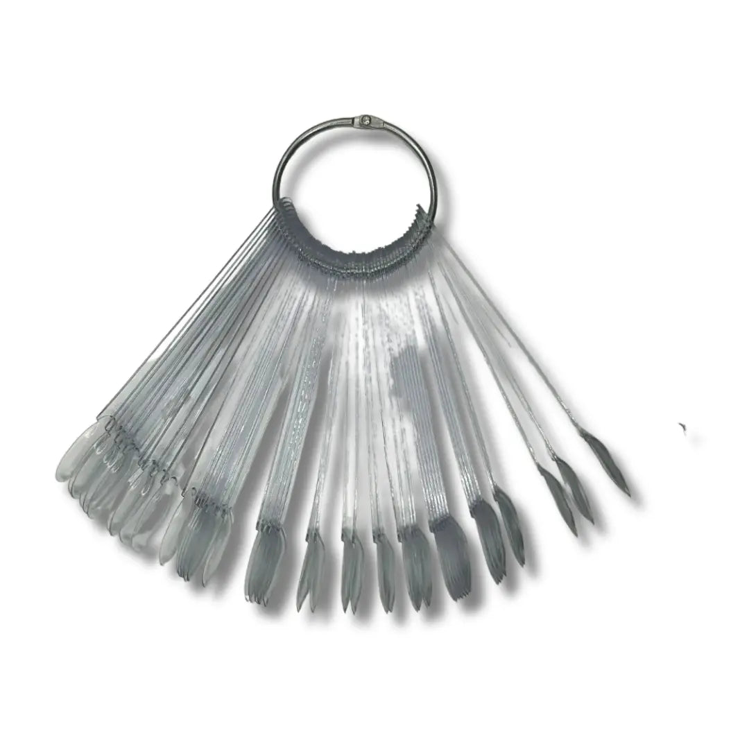 Set of gray nail art tips with a ring holder on a white background