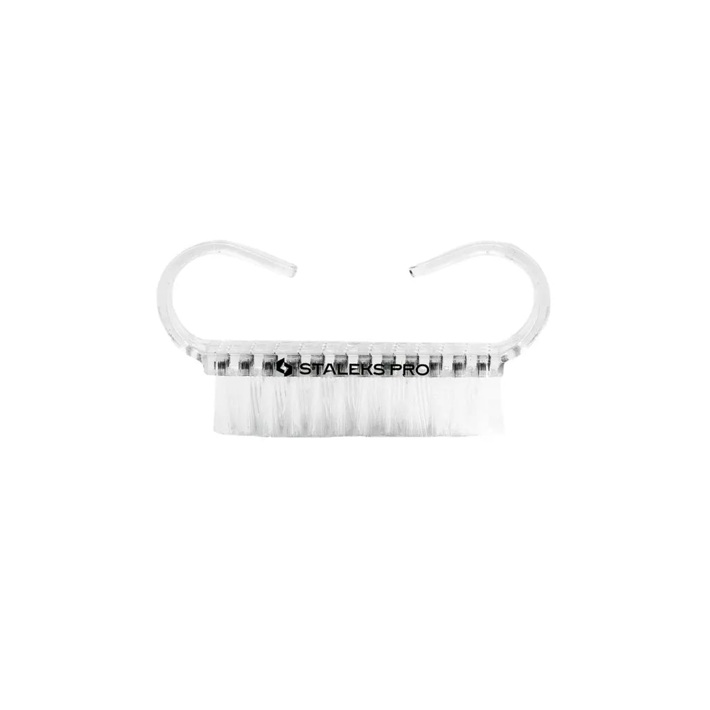Closeup of Staleks PRO manicure dust brush showing transparent handle and synthetic bristles