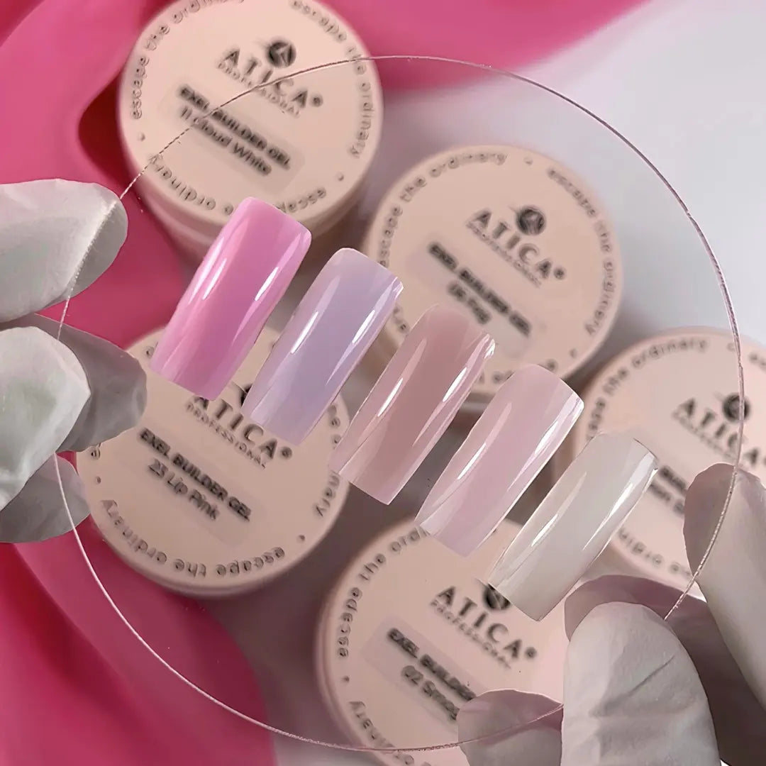 Nail polish samples with ATICA branding on a pink tray.