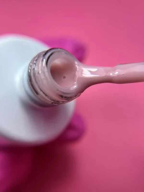 Jelly Gelly Fiber Base Coat Powder Puff 15ml – a glass fiber-enriched base coat with a soft, powder puff hue, providing a flawless finish, strength, and excellent adhesion.