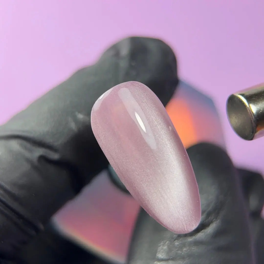 Highly pigmented rich Rose Silk color with dimensional cat eye magnet effect gel polish swatch closeup