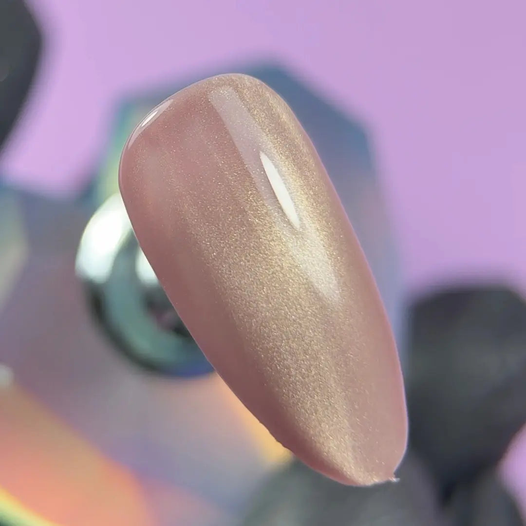 Highly pigmented rich Blush Silk color with dimensional cat eye magnet effect gel polish swatch closeup