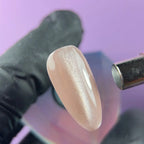 Highly pigmented rich Latte Silk color with dimensional cat eye magnet effect gel polish swatch closeup