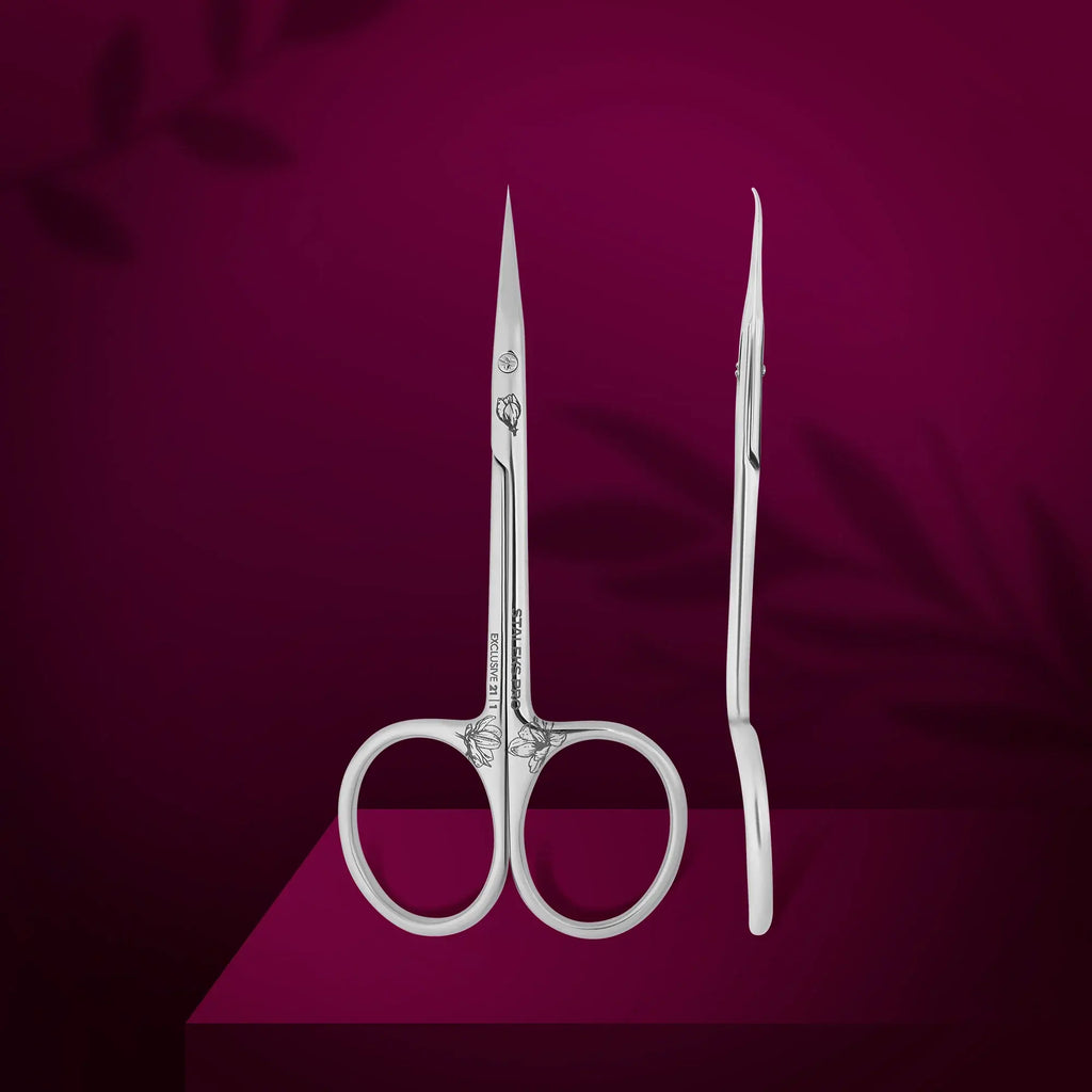 Magnolia engraved scissor handles and microscope sharpened blades