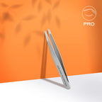 Narrow beveled tweezer tip closeup on matte surface