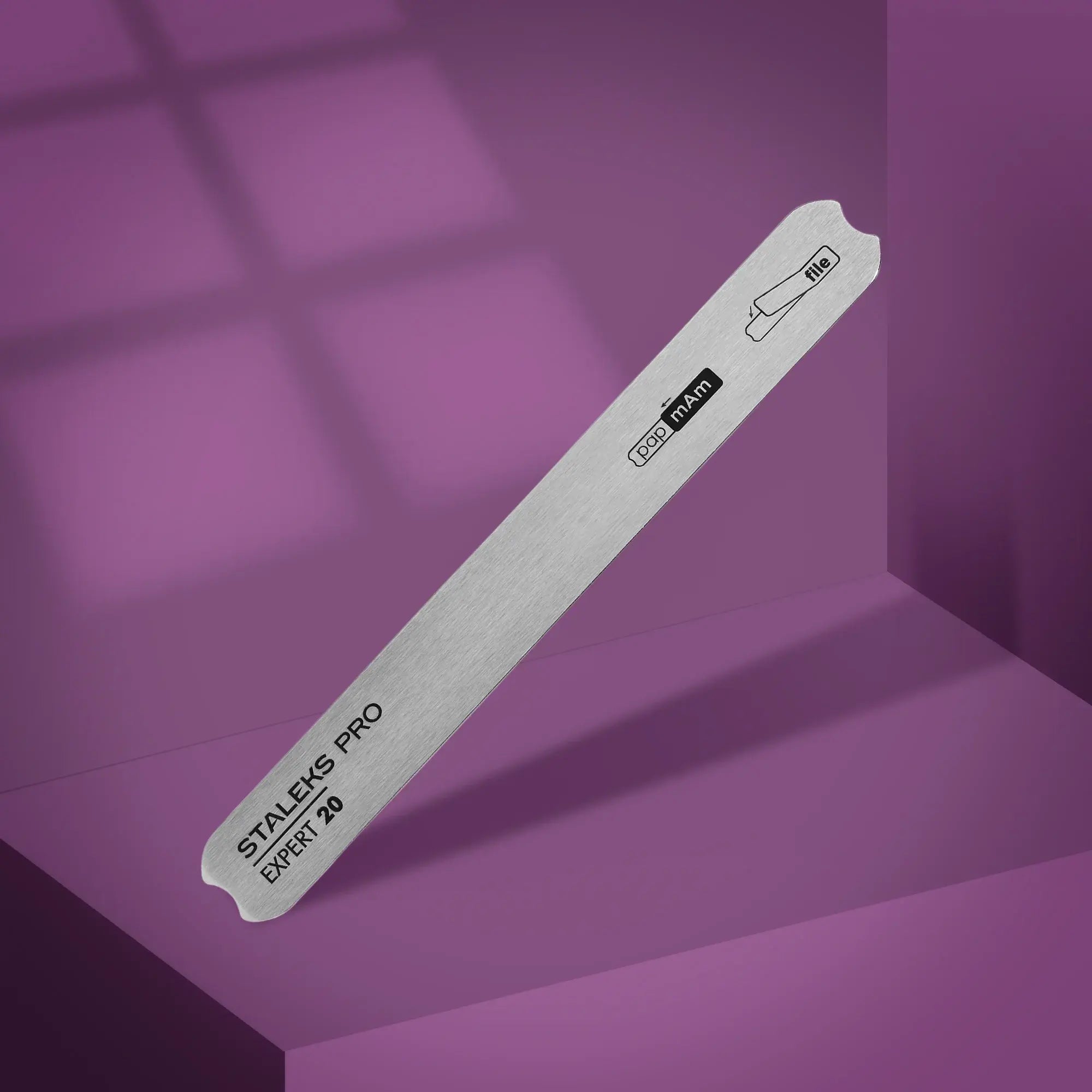 Professional metal nail file holder with a polished surface for easy attachment of disposable files.
