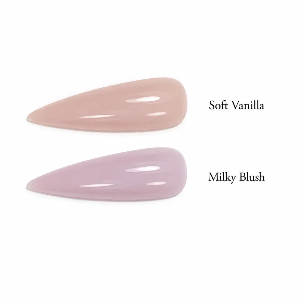 Two almond-shaped nail tips displayed side by side on a white background, labeled 'Soft Vanilla' in a pale peach-beige shade and 'Milky Blush' in a very light pink-lilac shade.