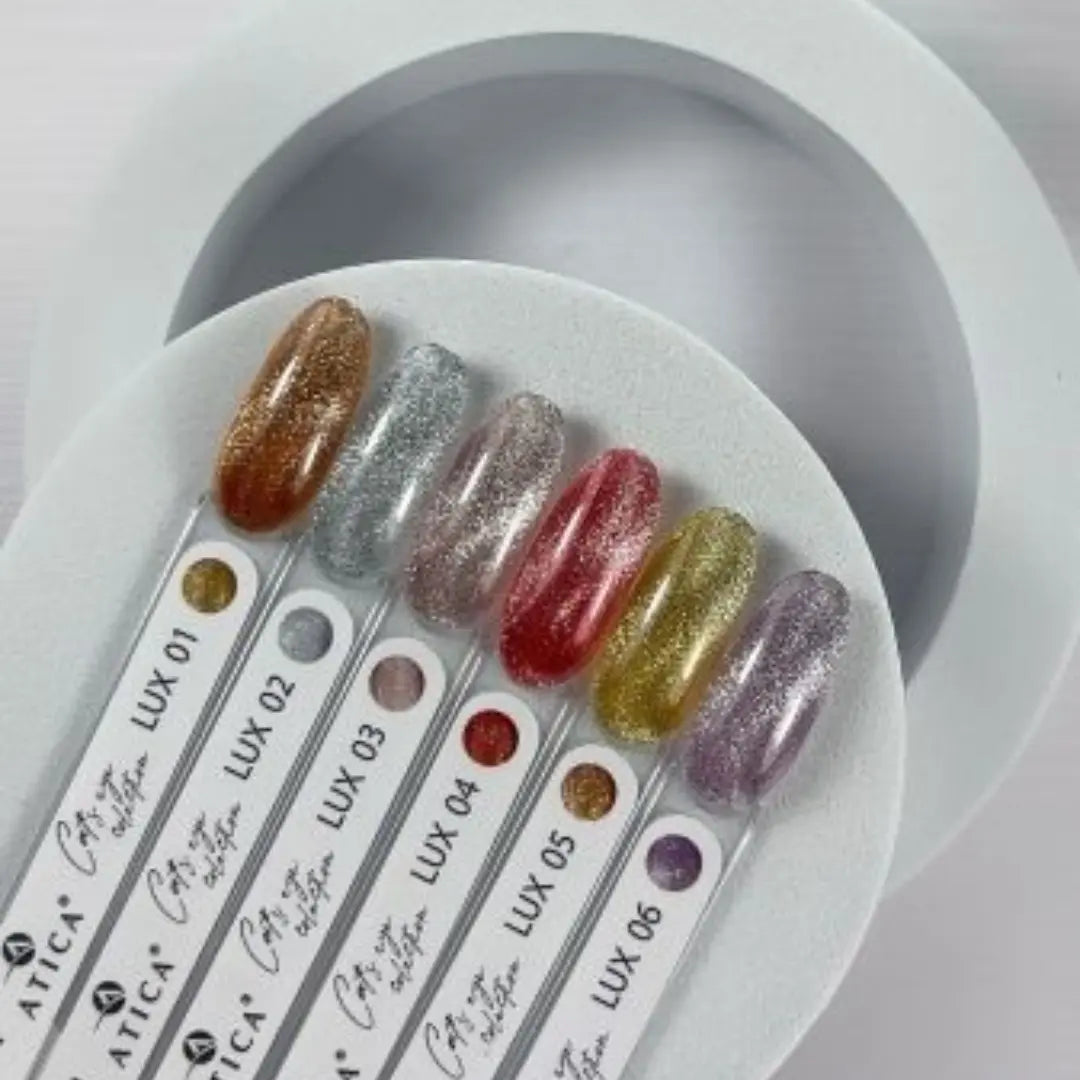 Nail color swatches with glittery finishes on a white circular tray.