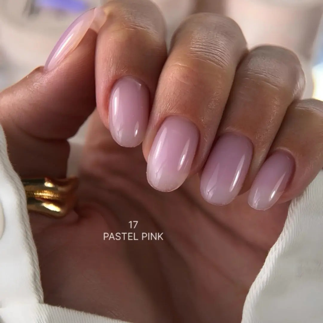 Hand with pastel pink nails and a gold ring, labeled '17 Pastel Pink'.