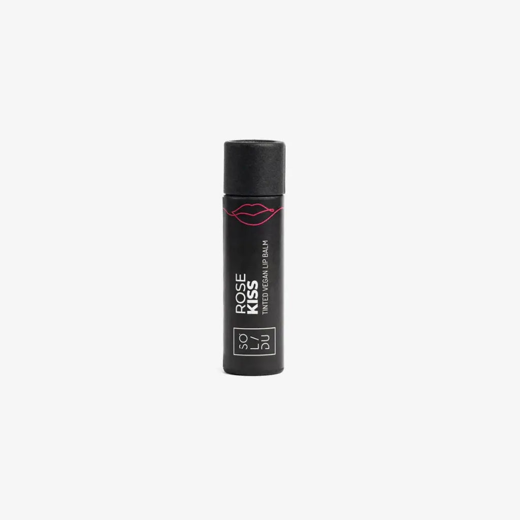 Black lip balm container with 'Rose Kiss' text on a white background