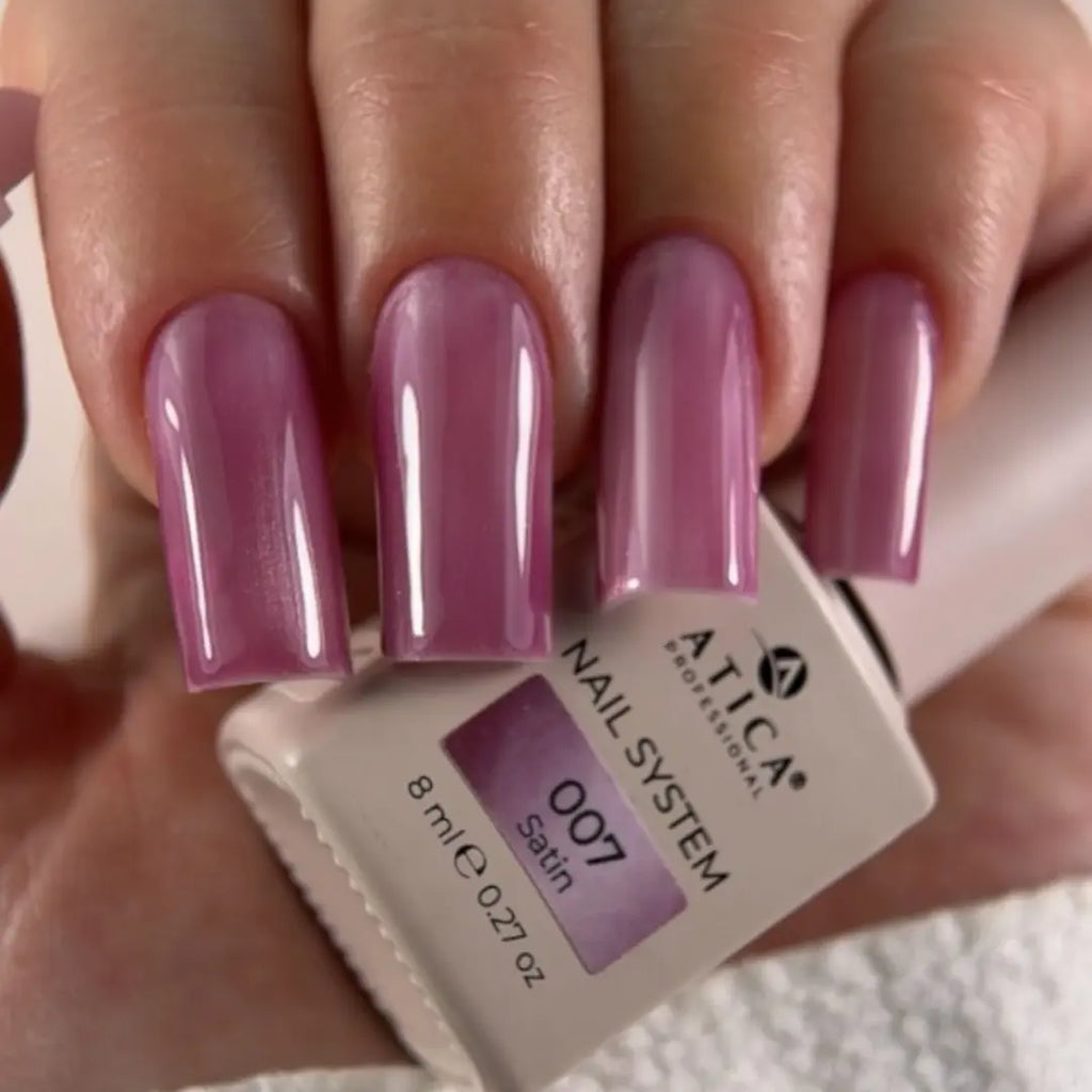 Satin mauve nail polish texture swatch, subtle glow effect