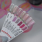 Nail color swatch card with pink and gray nail samples on a colorful background
