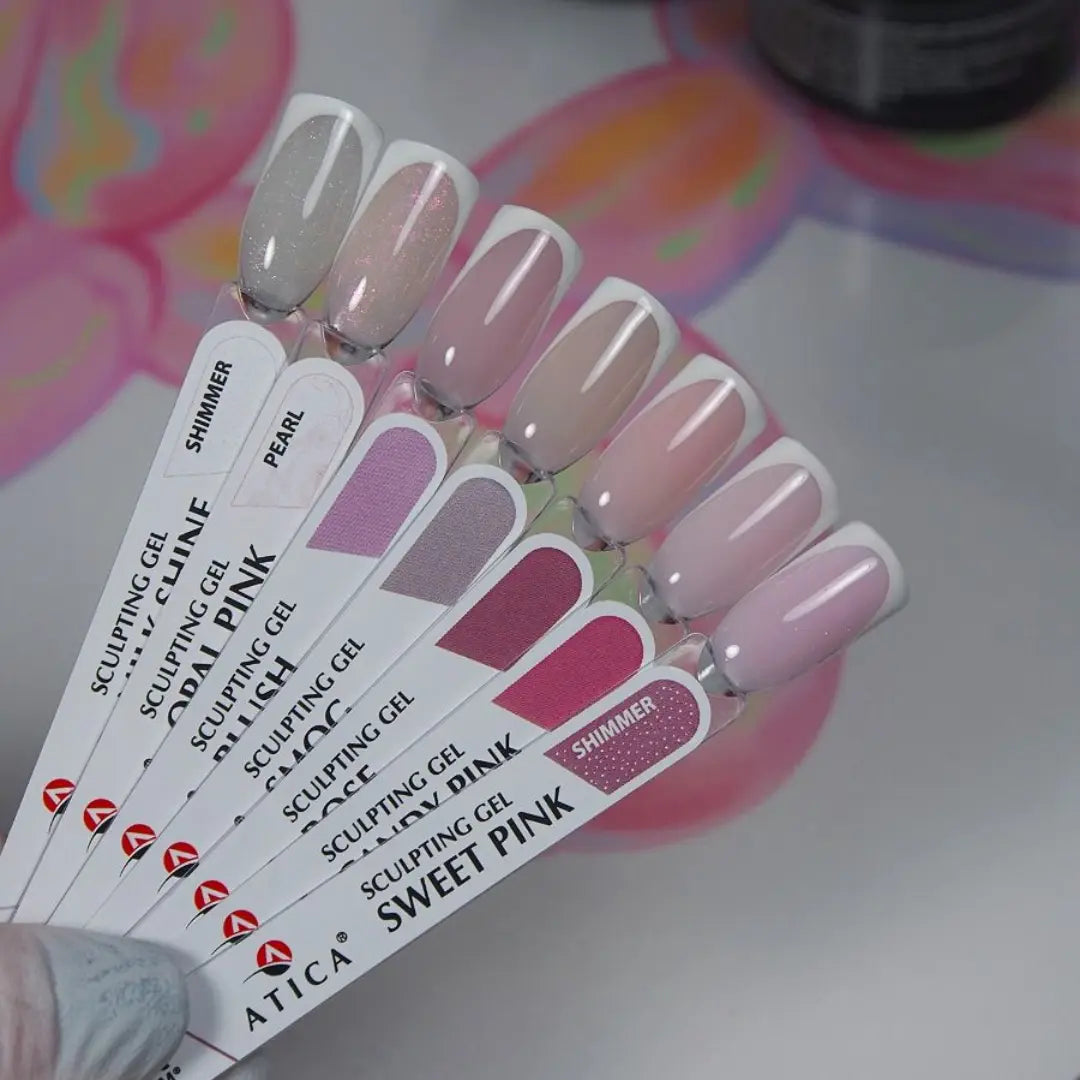 Nail color swatch card with pink and gray nail samples on a colorful background
