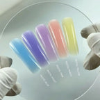 Pastel nail polish swatches on a clear background with labeled colors.