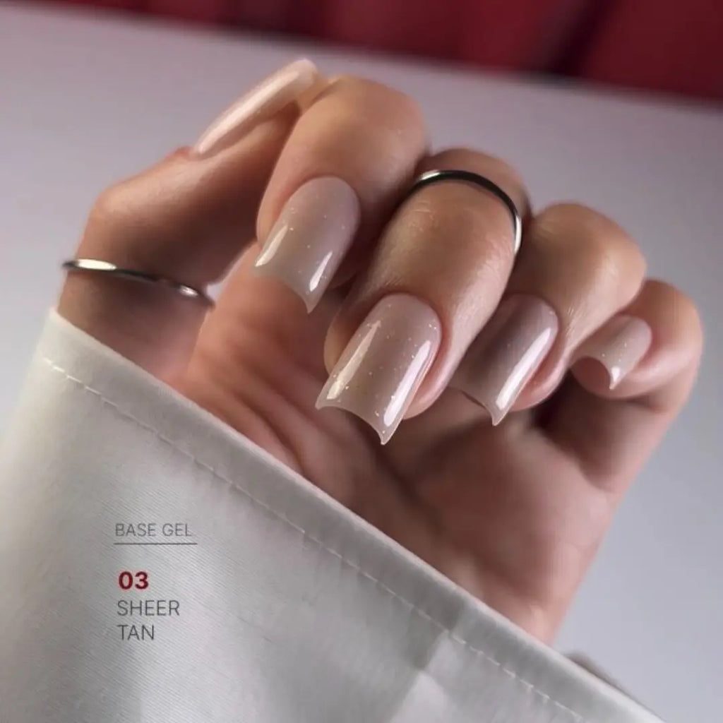 Sheer tan nude nail base texture swatch, subtle light reflecting effect