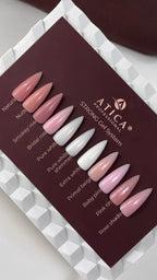 Set of artificial nails in various colors on a display card with 'Artica' branding.