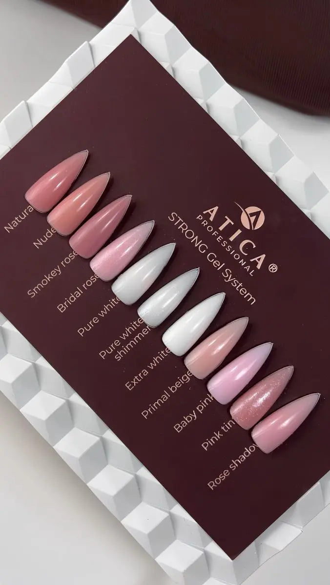 Set of artificial nails in various colors on a display card with 'Artica' branding.