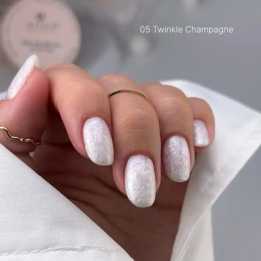 Champagne shimmer nude nail gel texture, bridal pearl manicure effect