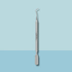 Curved curette tip and rounded pusher end closeup